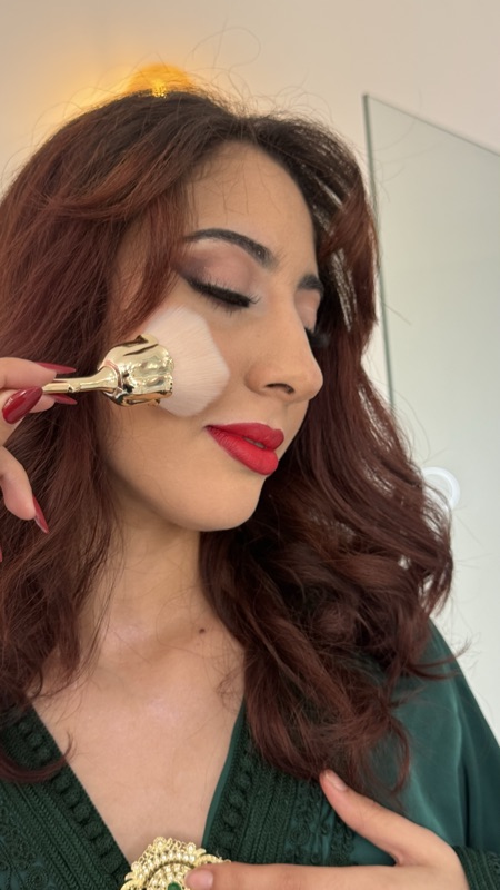 Beauty close-up with a matte red lip and winged eyeliner